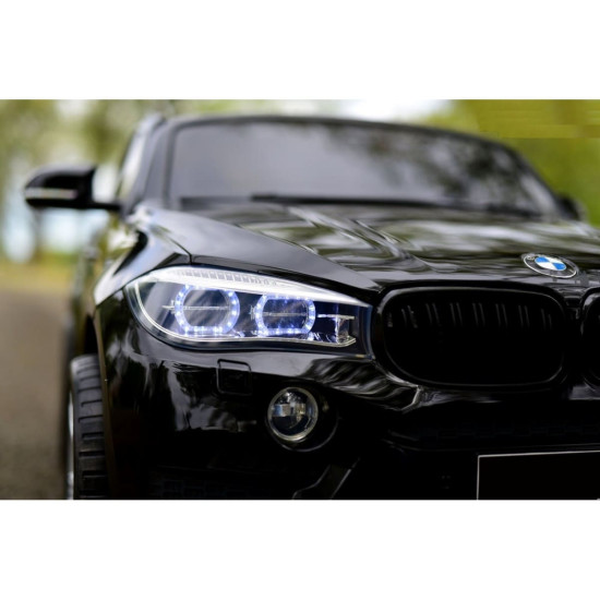 Акумулаторен двуместен джип BMW X6M 12V с дистанционно управление меки гуми и кожена седалка 2024 Акумулаторен двуместен джип BMW X6M 12V с дистанционно управление меки гуми и кожена седалка 2024